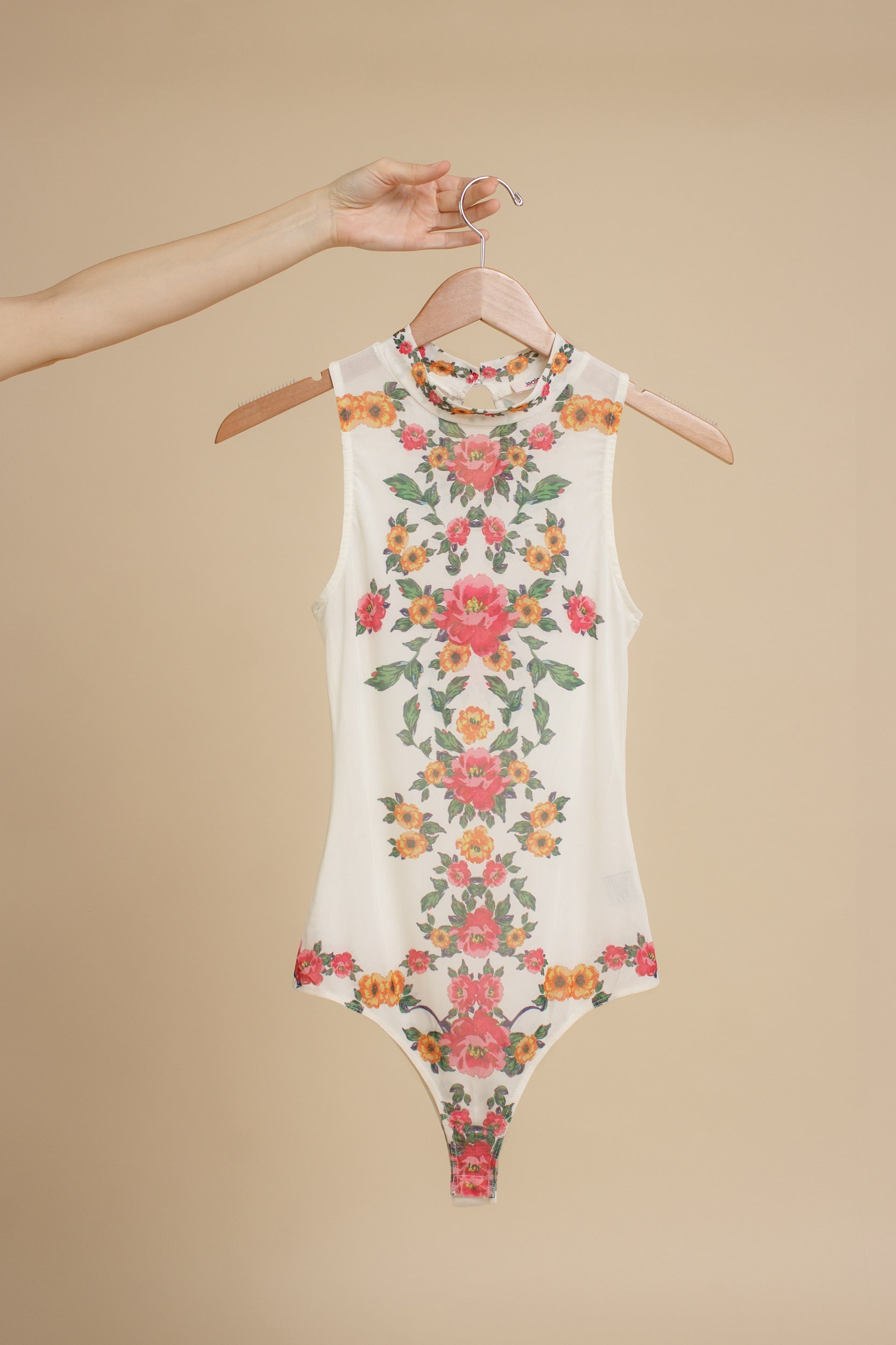Floral mesh bodysuit, in cream.