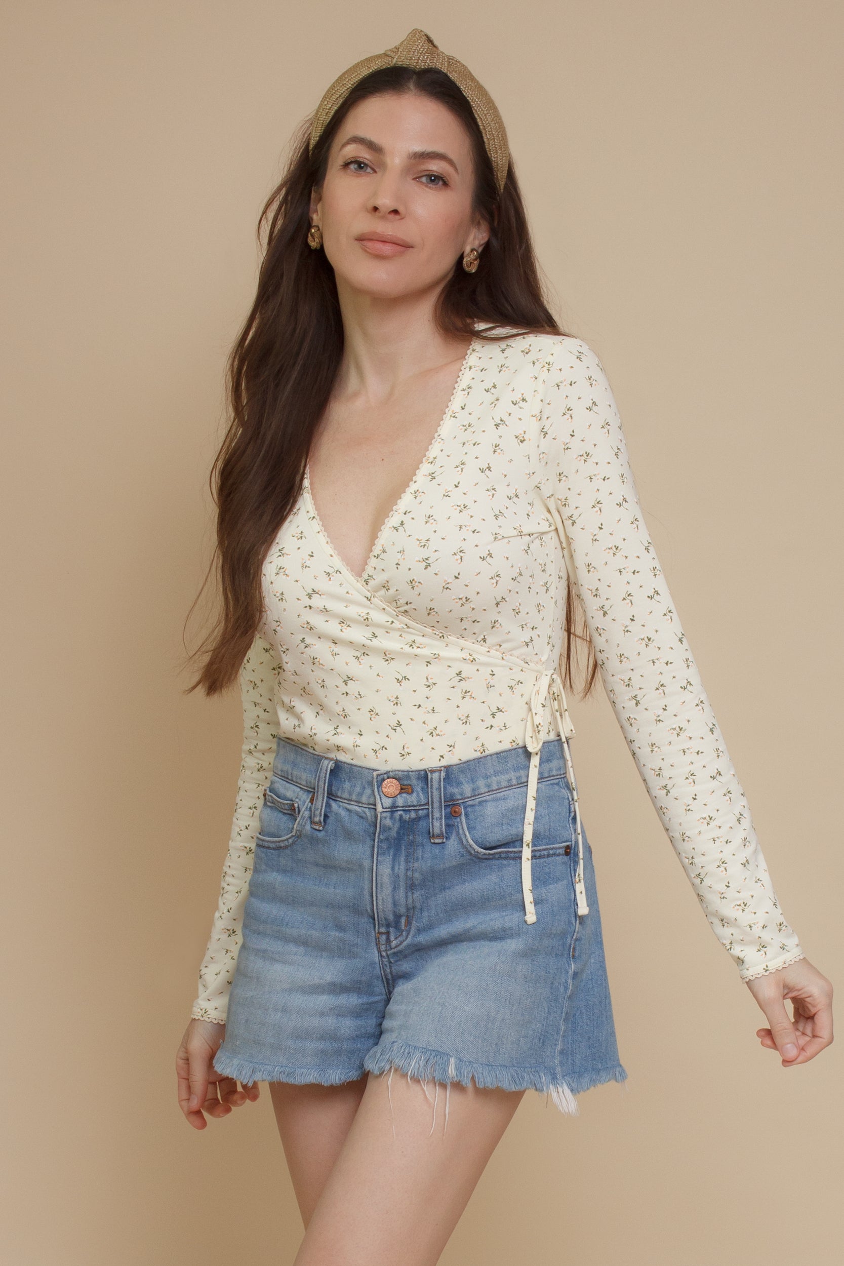 Floral print, wrap style bodysuit, in light yellow.