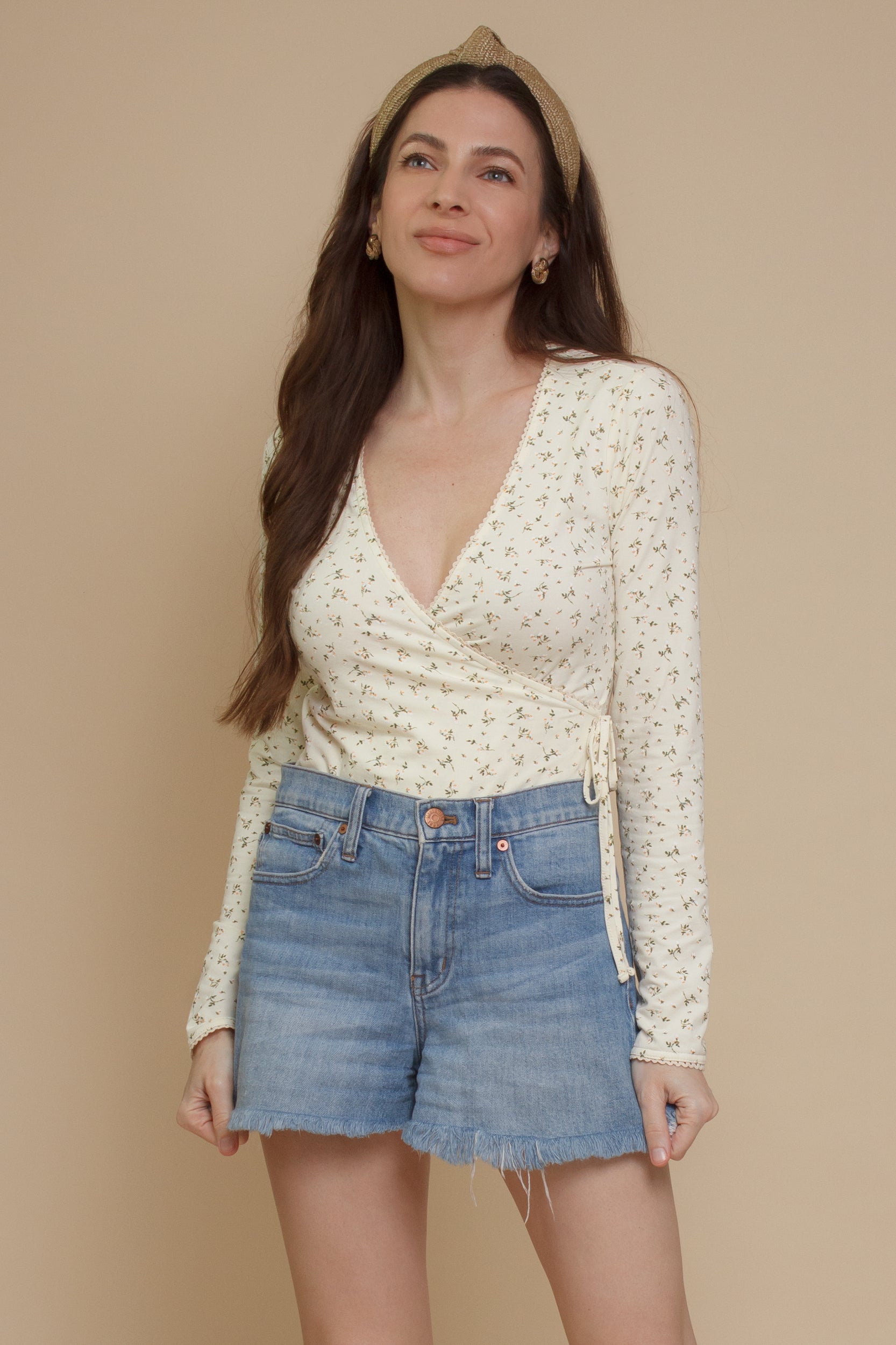 Floral print, wrap style bodysuit, in light yellow.