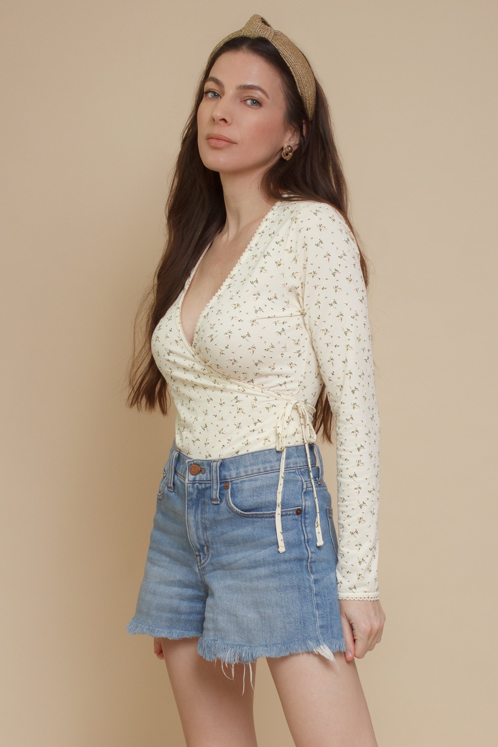 Floral print, wrap style bodysuit, in light yellow.
