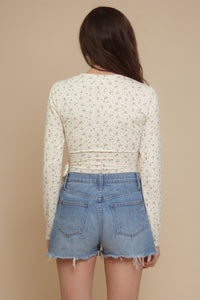 Floral print, wrap style bodysuit, in light yellow.