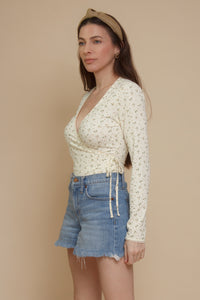 Floral print, wrap style bodysuit, in light yellow.