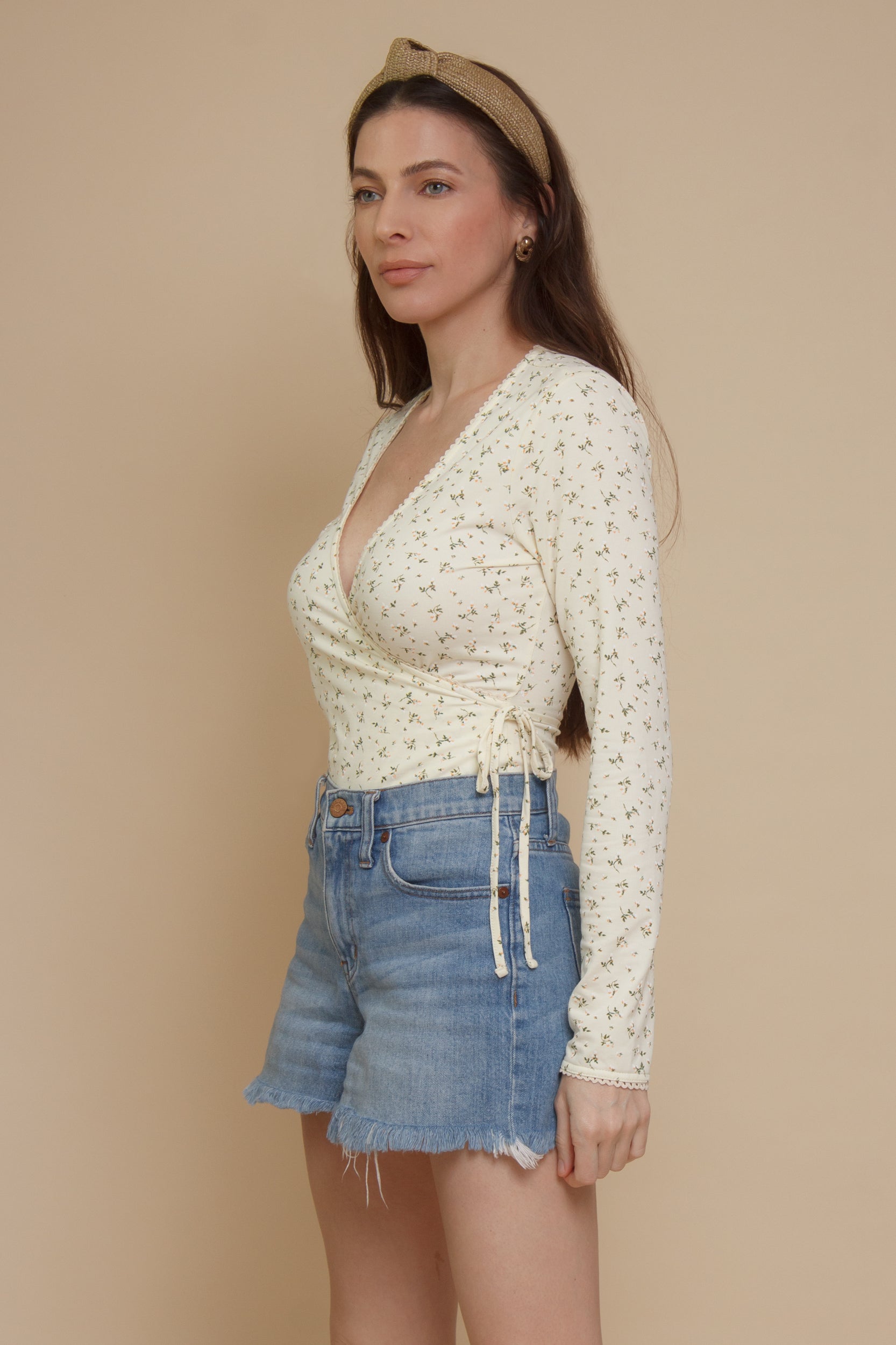 Floral print, wrap style bodysuit, in light yellow.