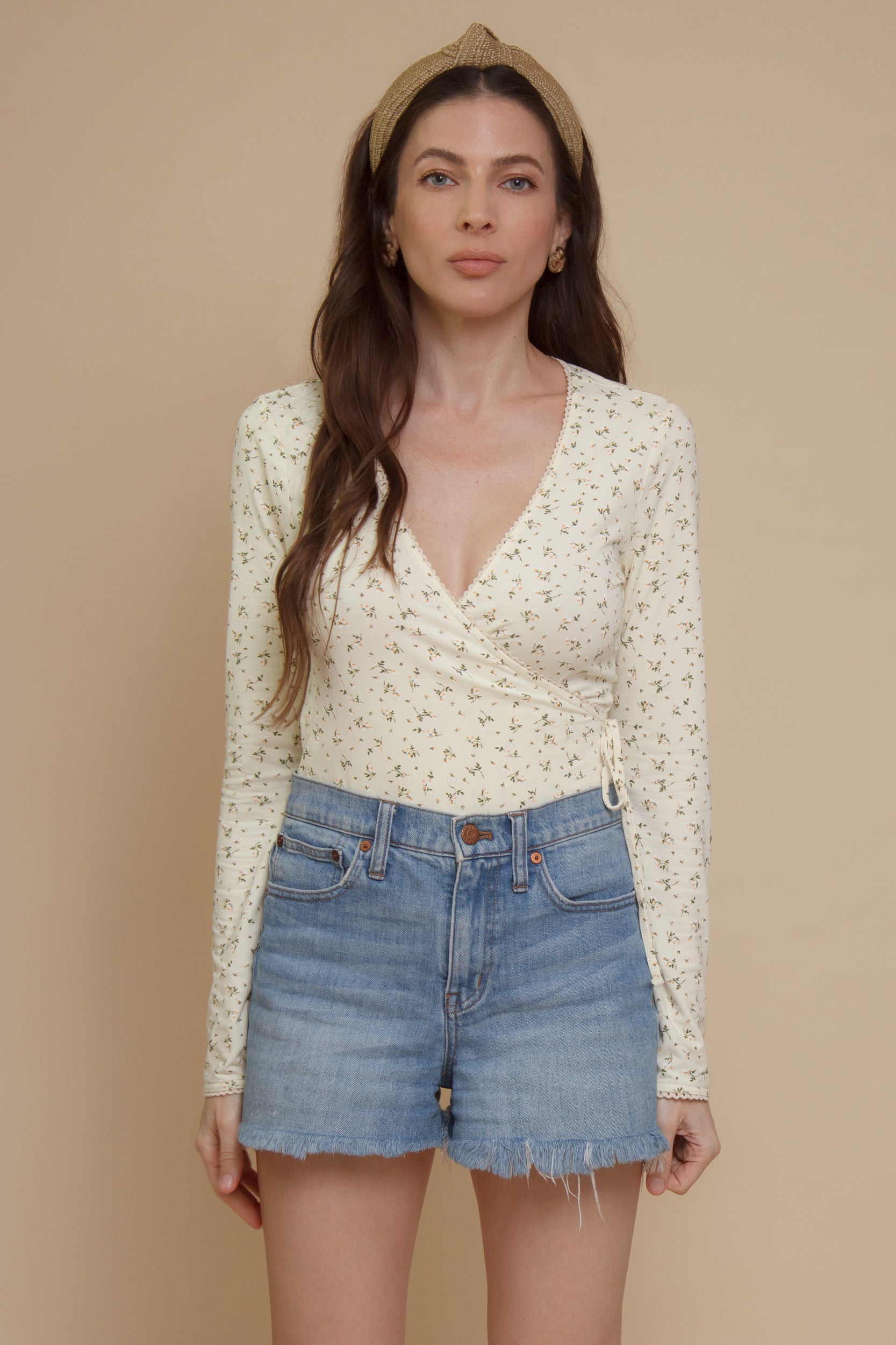 Floral print, wrap style bodysuit, in light yellow.