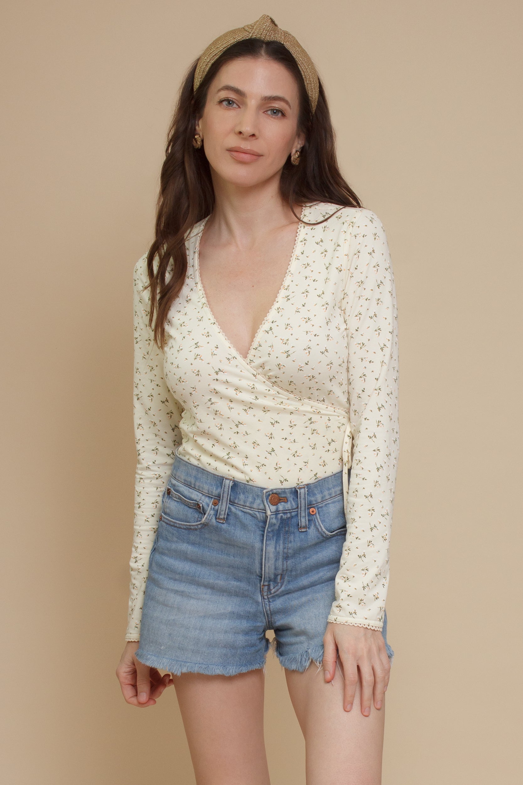 Floral print, wrap style bodysuit, in light yellow.