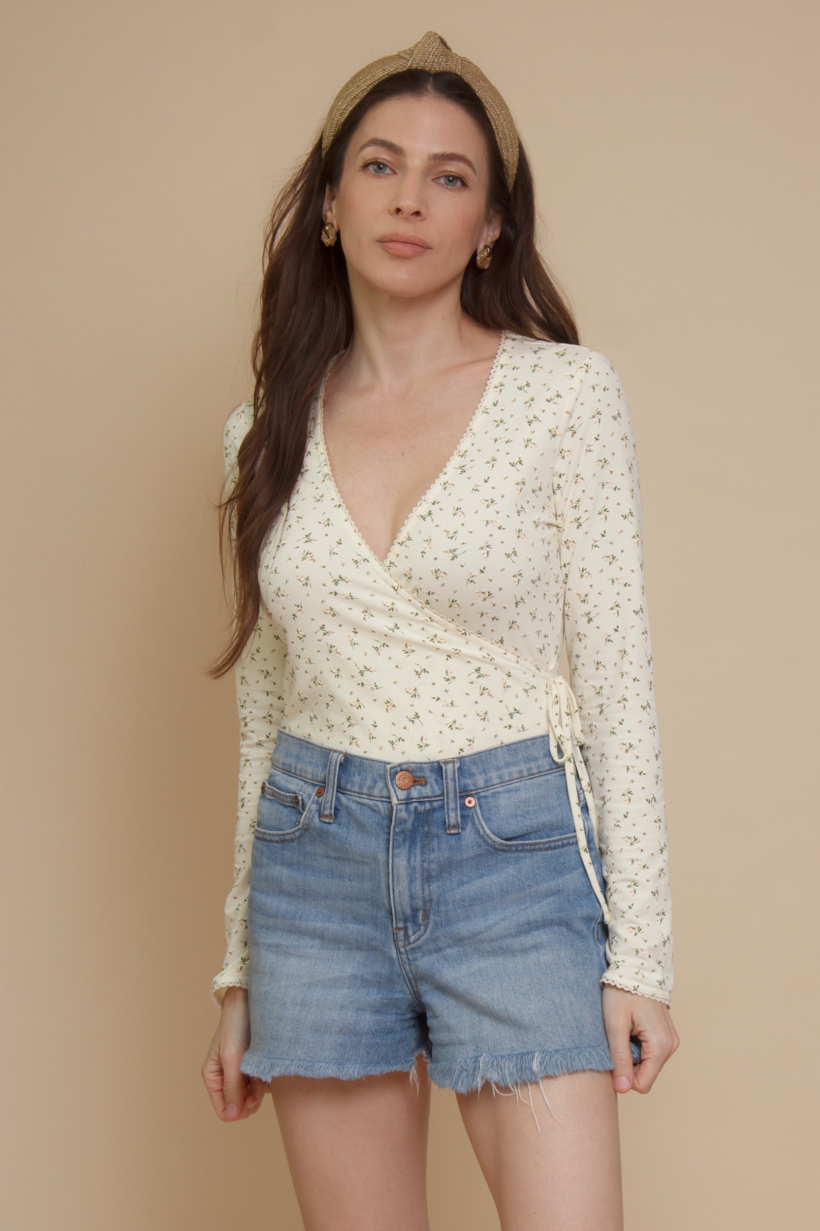 Floral print, wrap style bodysuit, in light yellow.