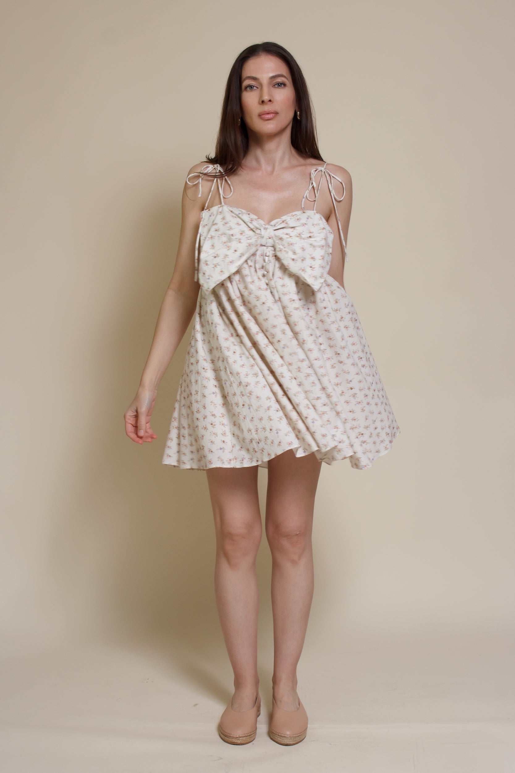 Storia ditsy floral bow front mini dress, in cream multi.