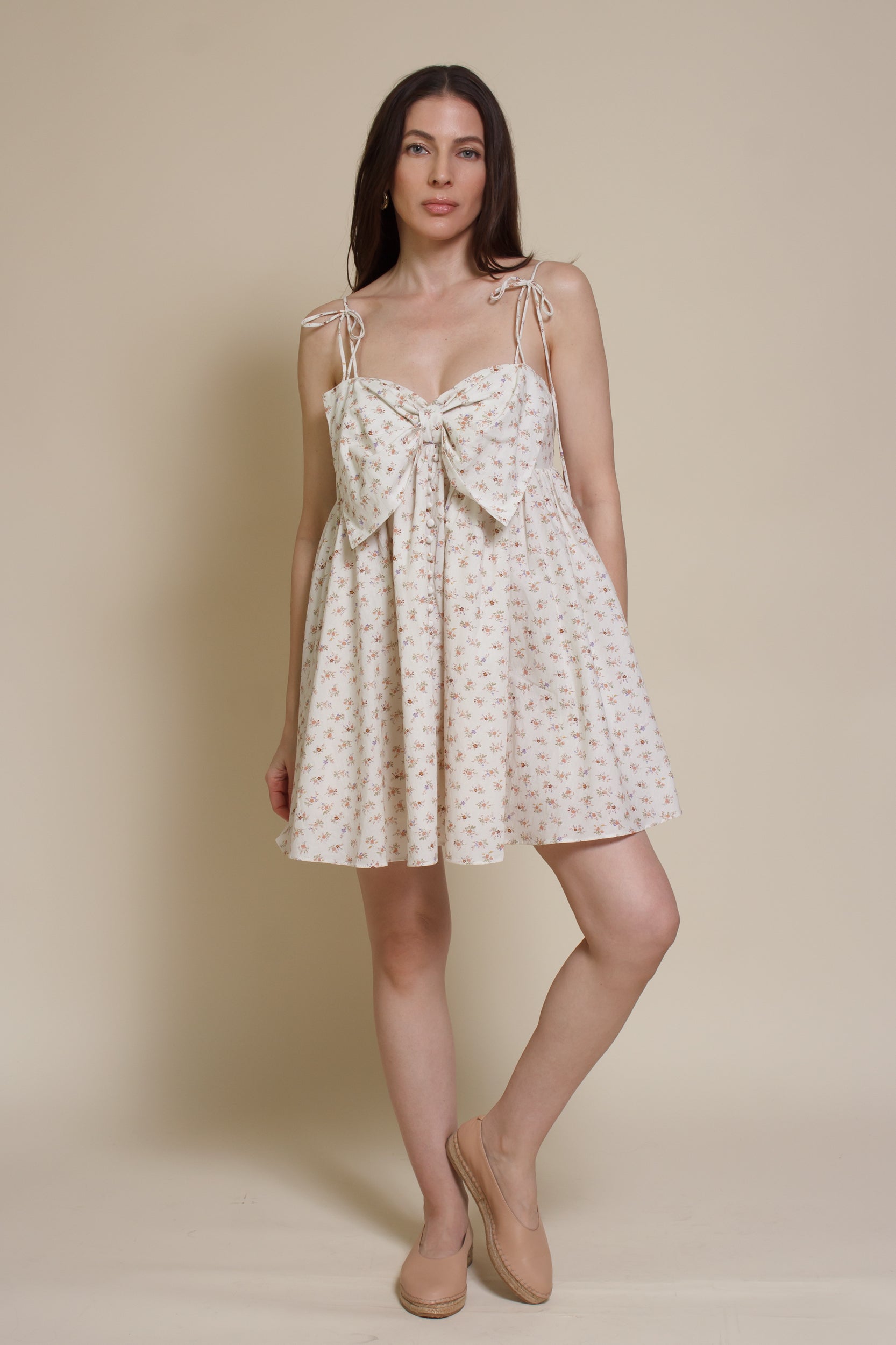 Storia ditsy floral bow front mini dress, in cream multi.