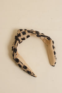 Franklin Sunset woven headband with black textured dots.