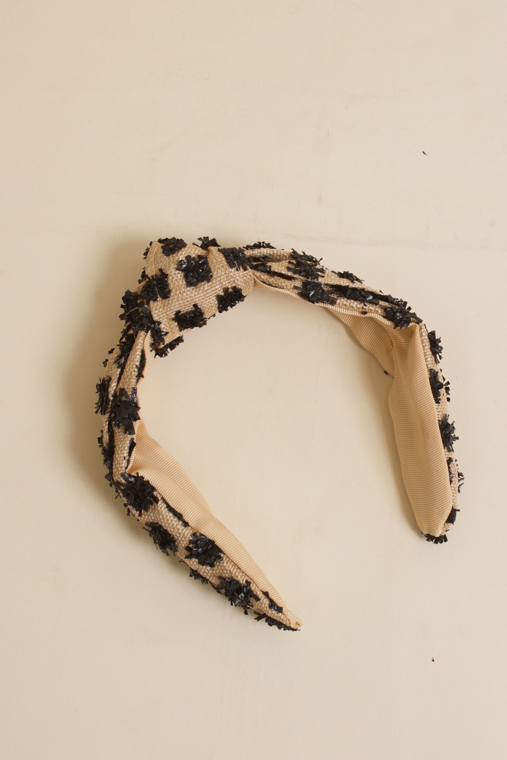 Franklin Sunset woven headband with black textured dots.