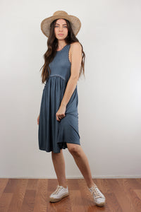 Babydoll style midi dress with exposed back zipper, in midnight blue.