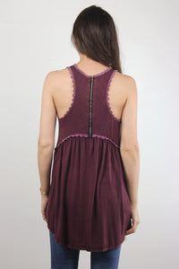Babydoll style top, with exposed back zipper, in burgundy.