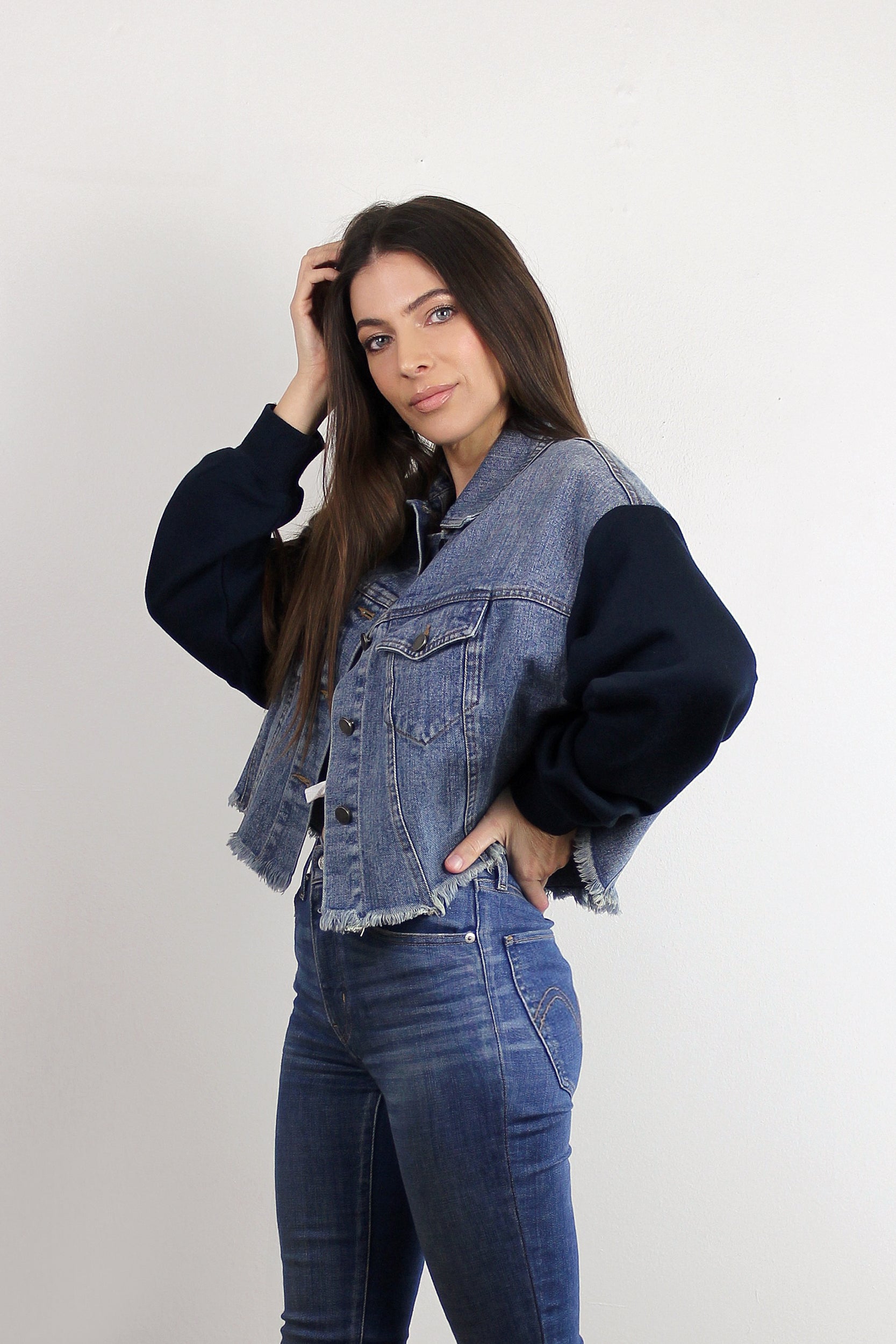 Cropped denim jacket with sweatshirt style sleeves. Image 2