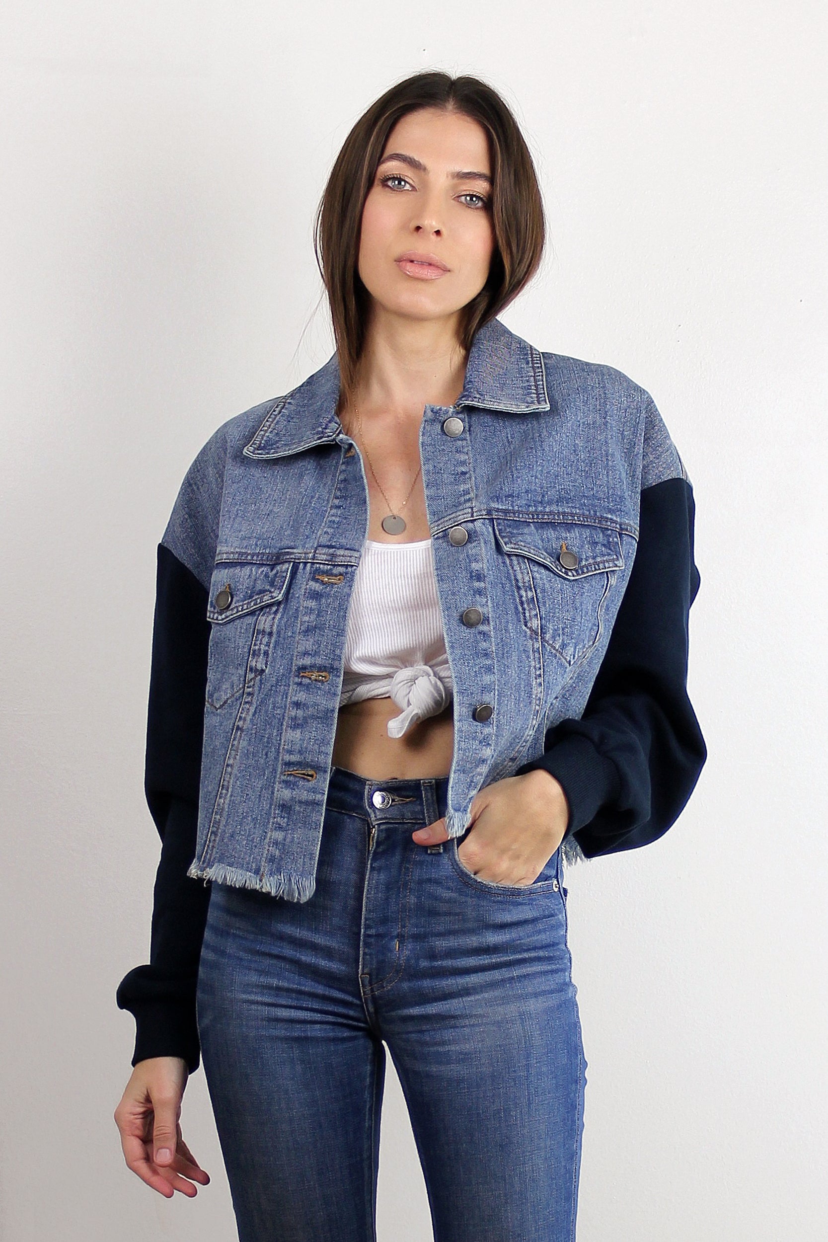 Cropped denim jacket with sweatshirt style sleeves. Image 5