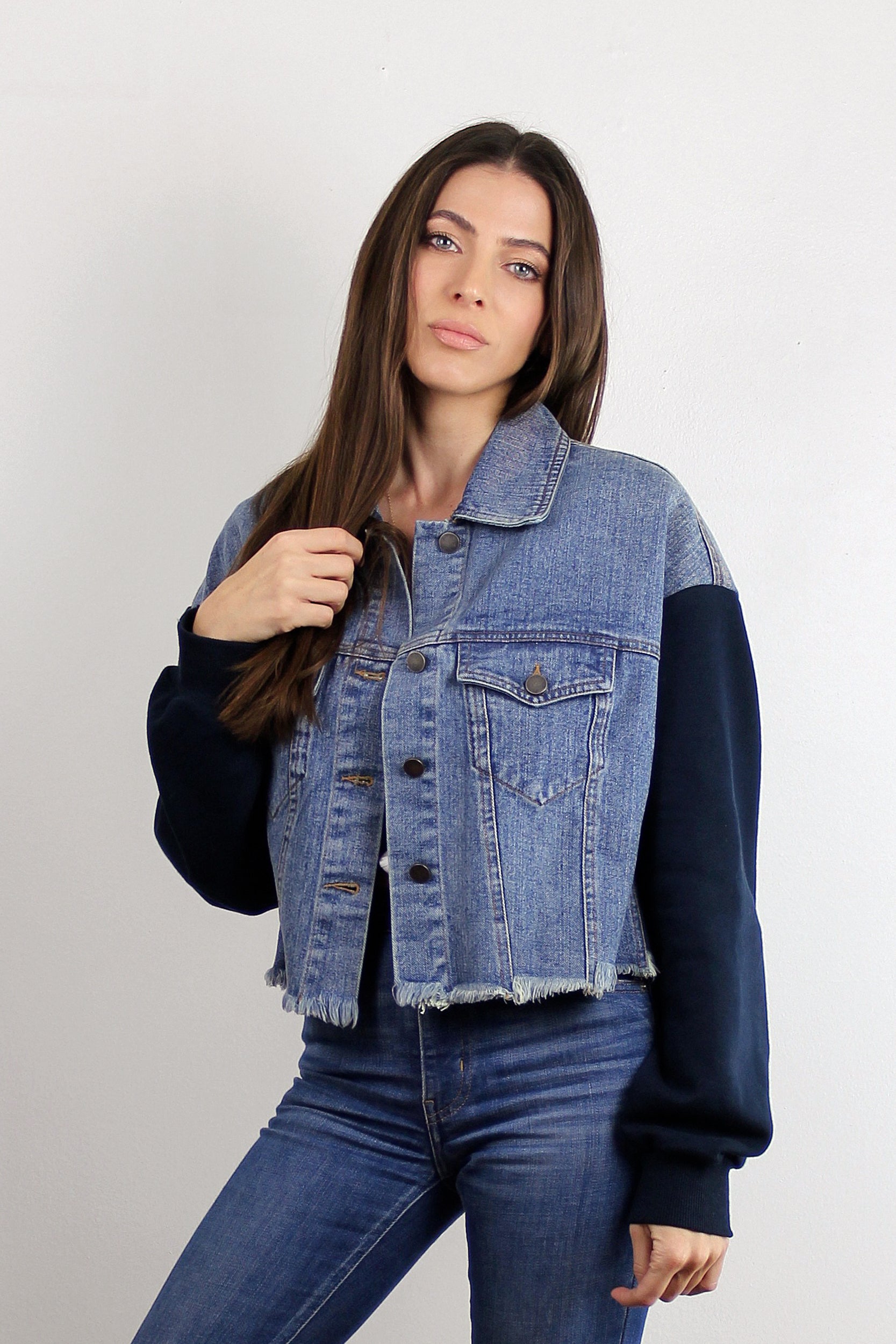 Cropped denim jacket with sweatshirt style sleeves. Image 6