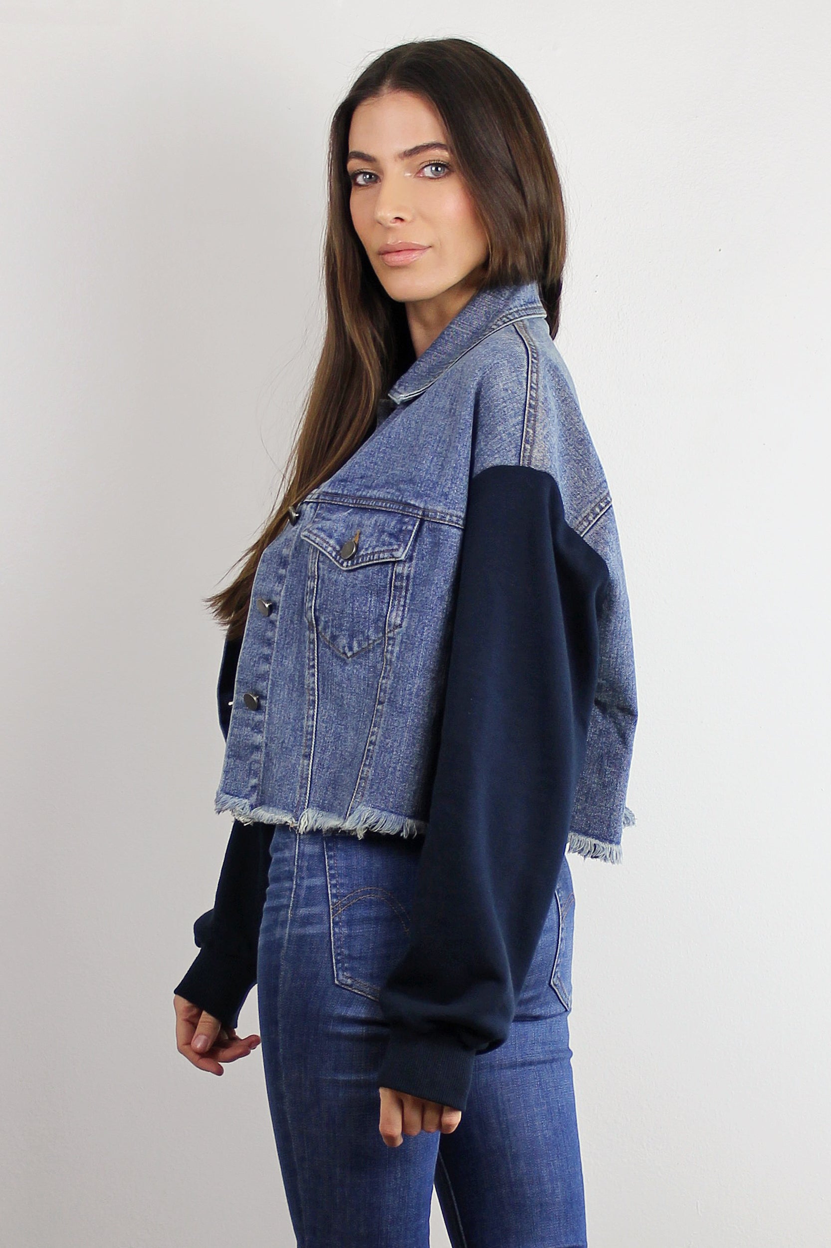 Cropped denim jacket with sweatshirt style sleeves. Image 7
