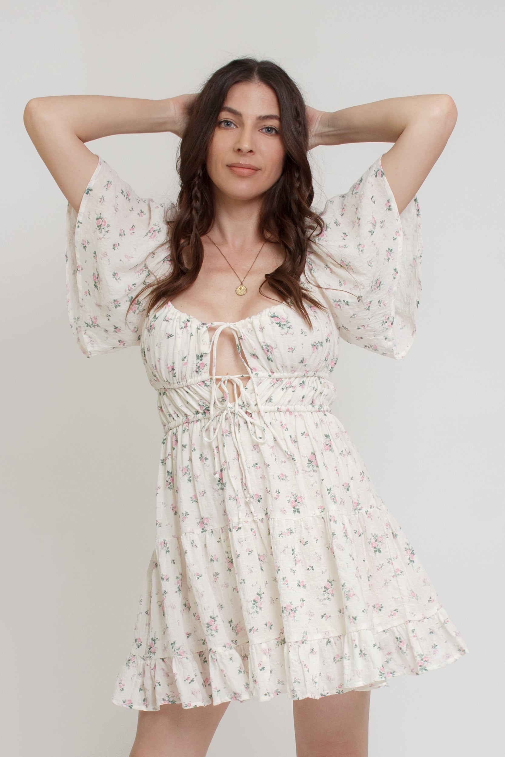 Floral mini dress, with flutter sleeves, in pink cream. Image 2