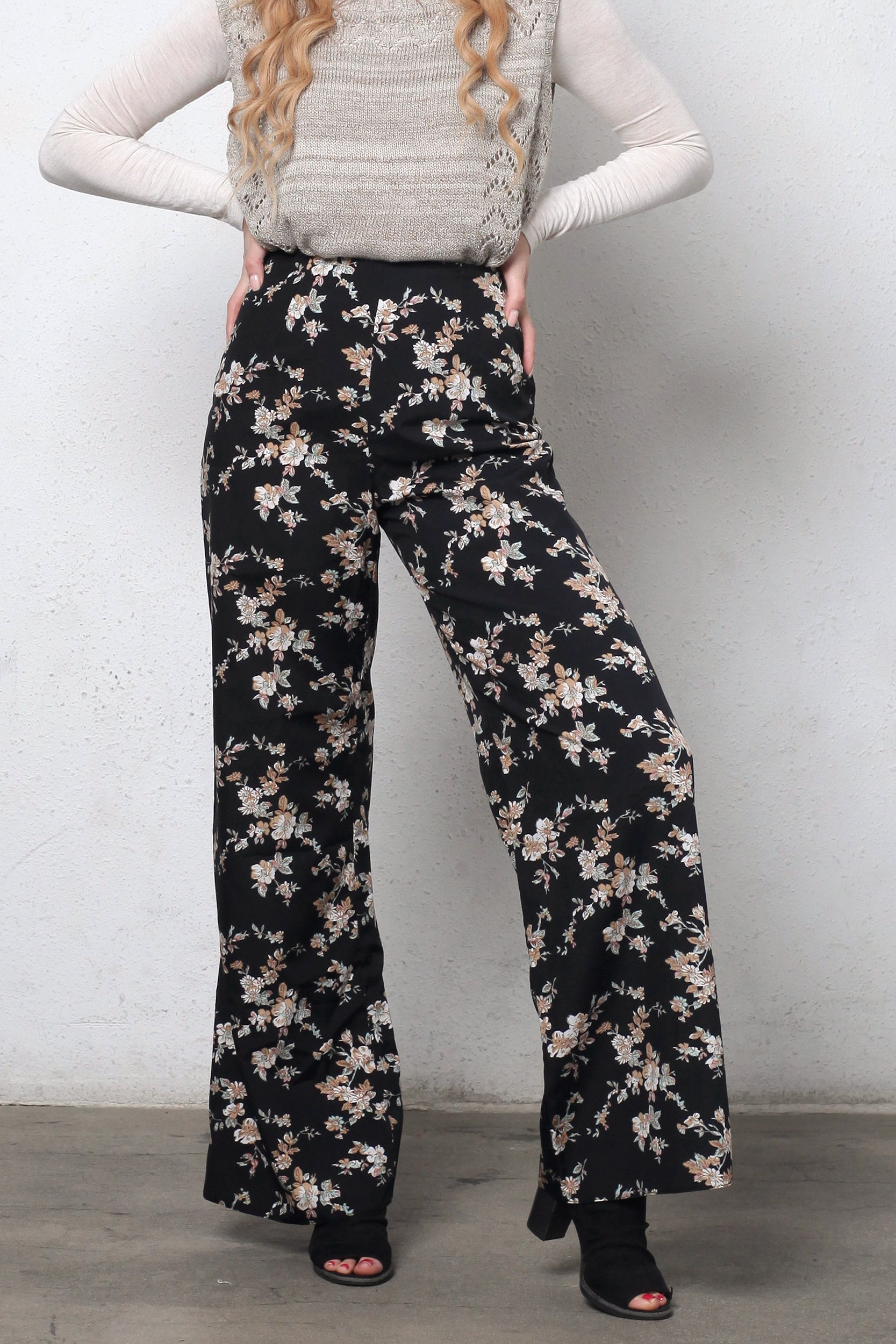 Wide leg, floral print pants, in black. Image 3