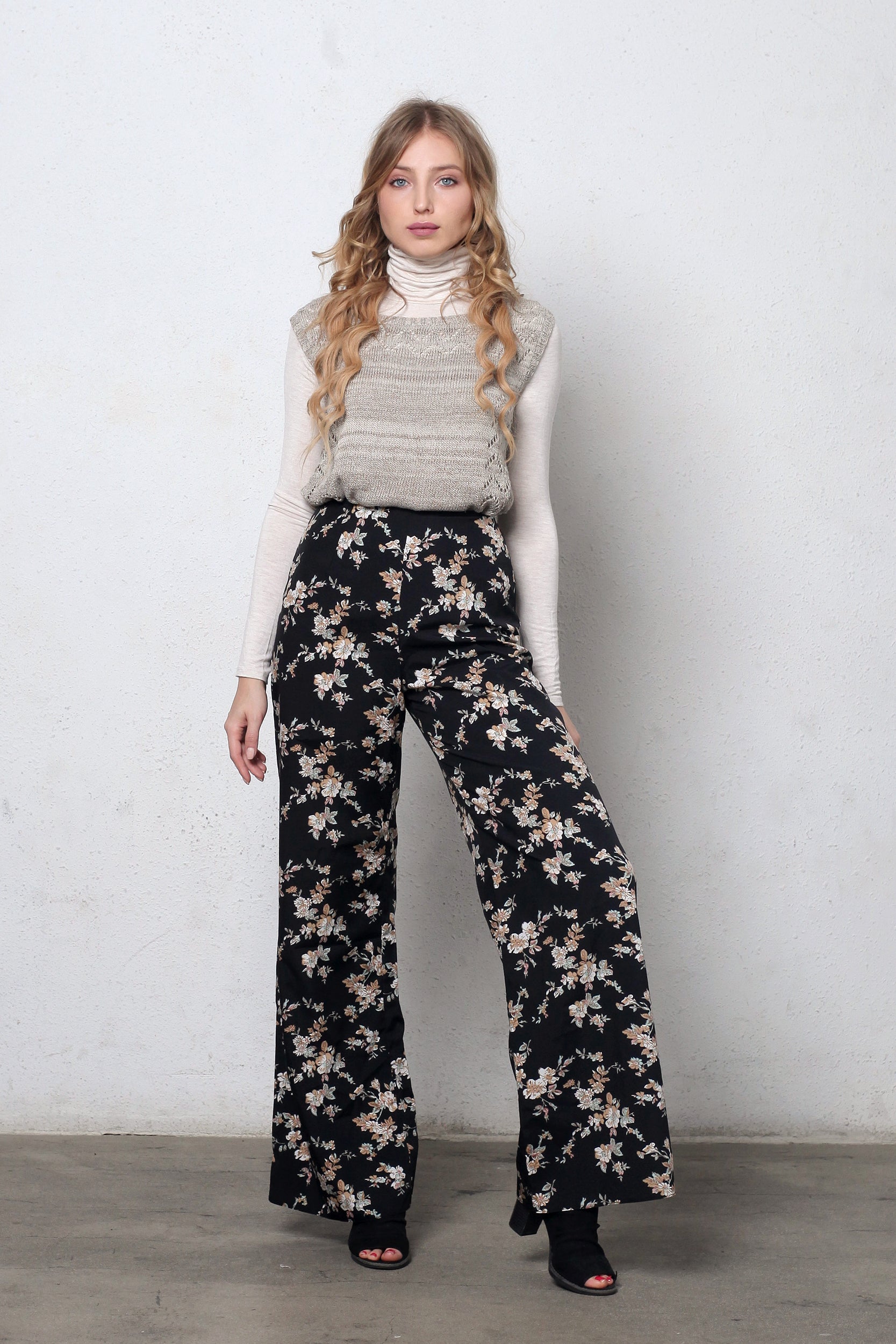 Wide leg, floral print pants, in black. Image 4