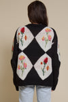 Bailey Rose diamond floral button front cardigan, in black.