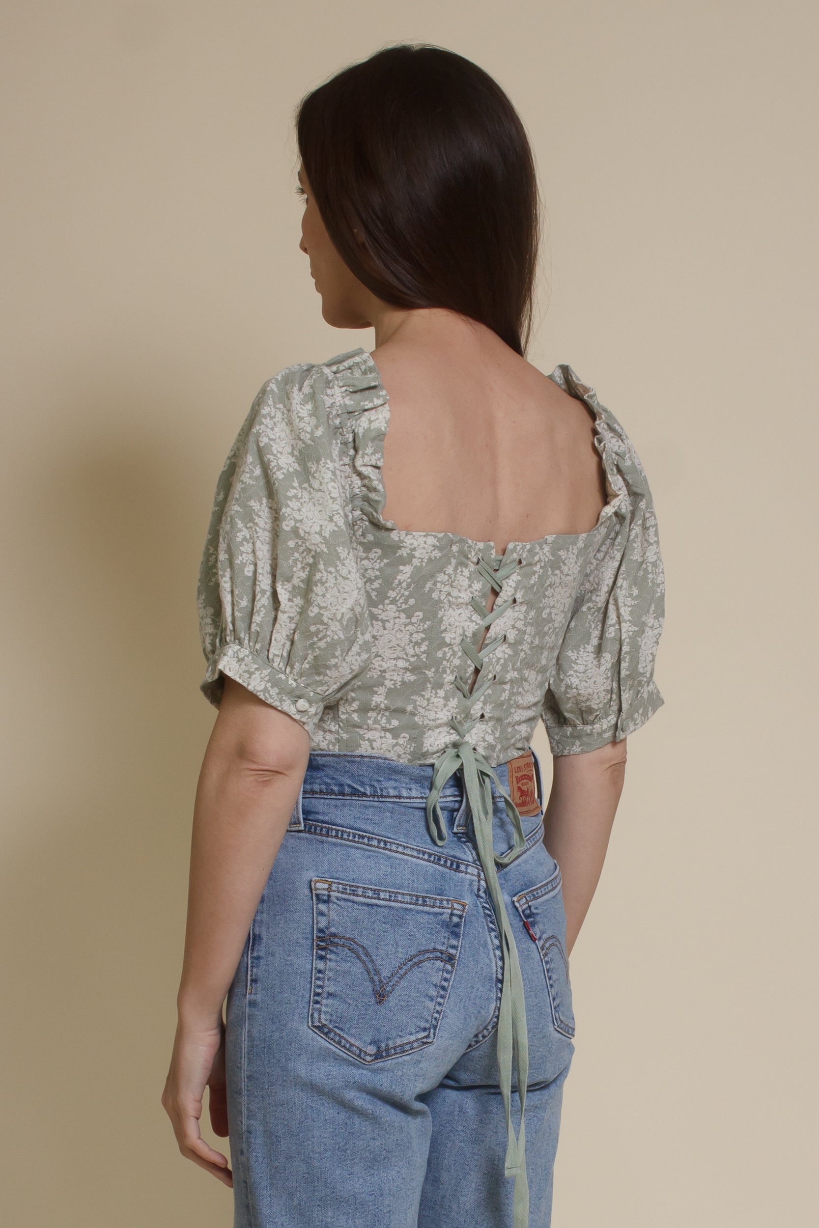 Olivaceous floral jacquard corset top with puff sleeves, in sage cream.
