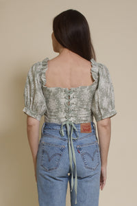 Olivaceous floral jacquard corset top with puff sleeves, in sage cream. (Back)