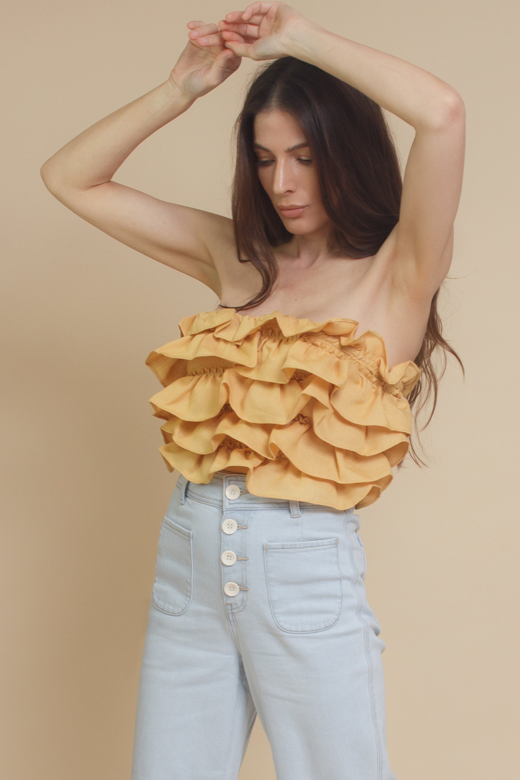 Mable ruffle tube top, with lace up back, in dusty yellow.
