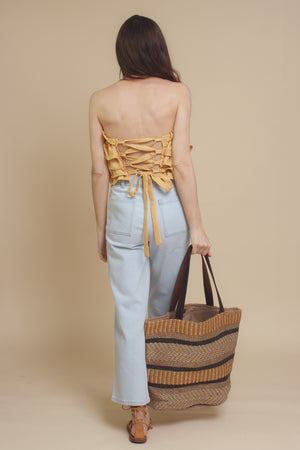 Mable ruffle tube top, with lace up back, in dusty yellow.
