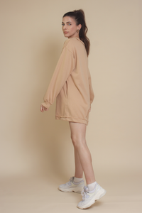 Henley style french terry romper, in tan.