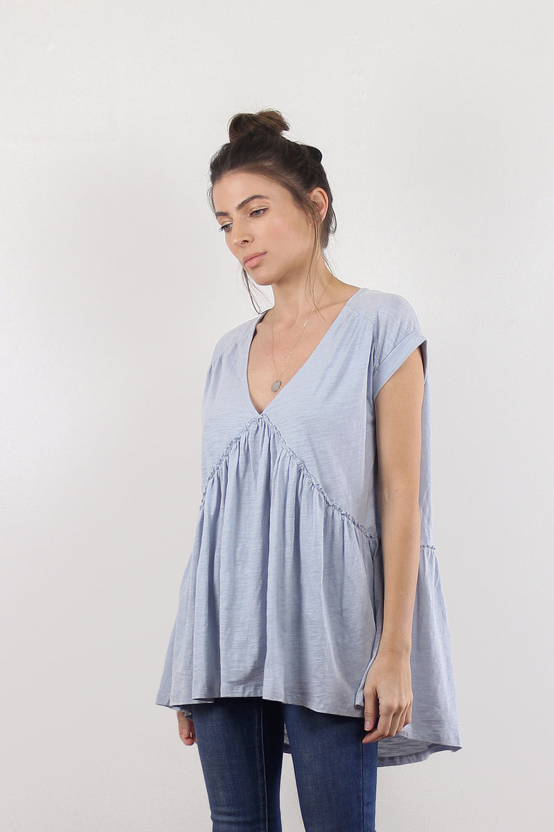 Babydoll style tee shirt, in light blue.