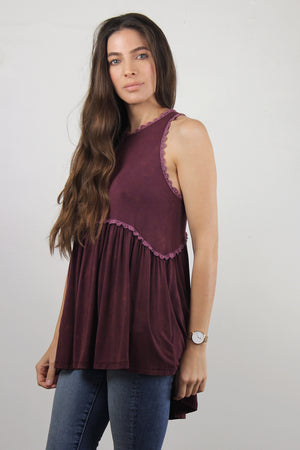 Babydoll style top, with exposed back zipper, in burgundy.