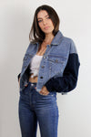 Cropped denim jacket with sweatshirt style sleeves.