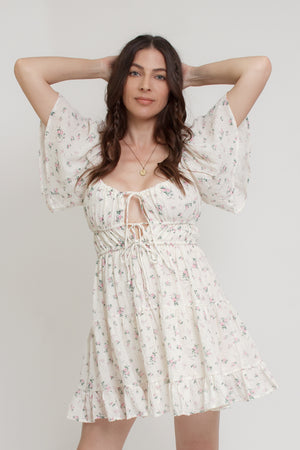 Floral mini dress, with flutter sleeves, in pink cream. Image 2