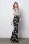 Wide leg, floral print pants, in black. Image 2