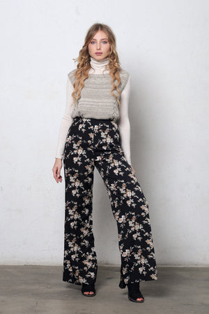 Wide leg, floral print pants, in black. Image 4