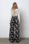 Wide leg, floral print pants, in black. Image 5