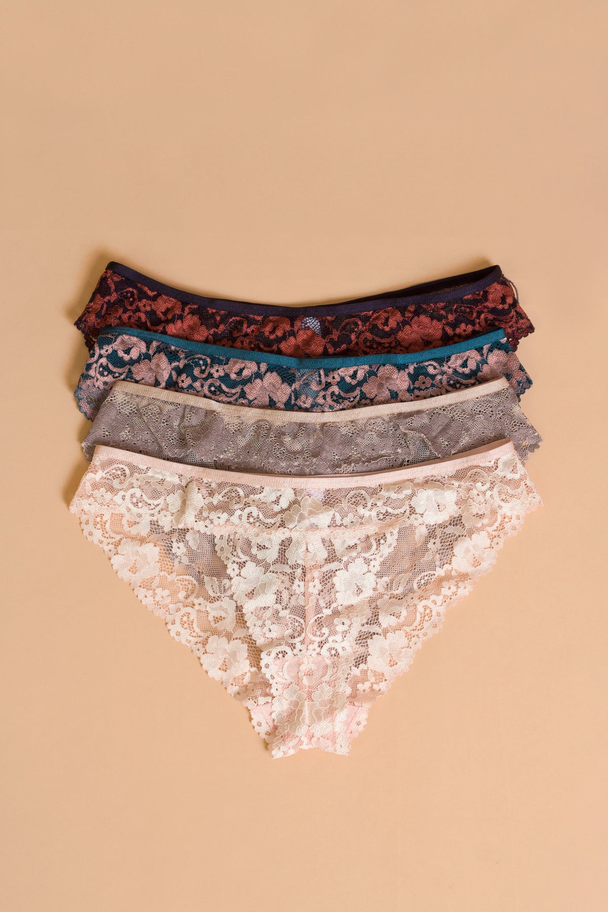 Lace panty flatlay, in assorted colors.