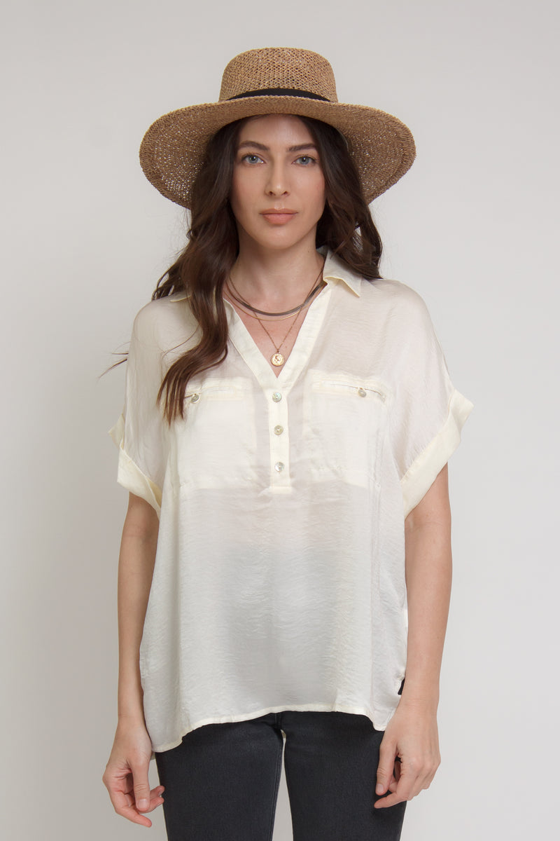 Silk henley blouse with rolled sleeves, in cream.