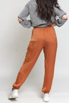 Silk joggers with drawstring waist, in caramel. Image 11
