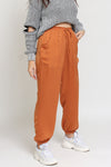 Silk joggers with drawstring waist, in caramel. Image 3
